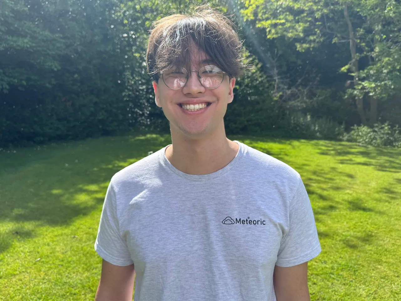 Portrait of Eric Nilsson, co-founder and CTO of Meteoric, outdoors in a Meteoric T-shirt